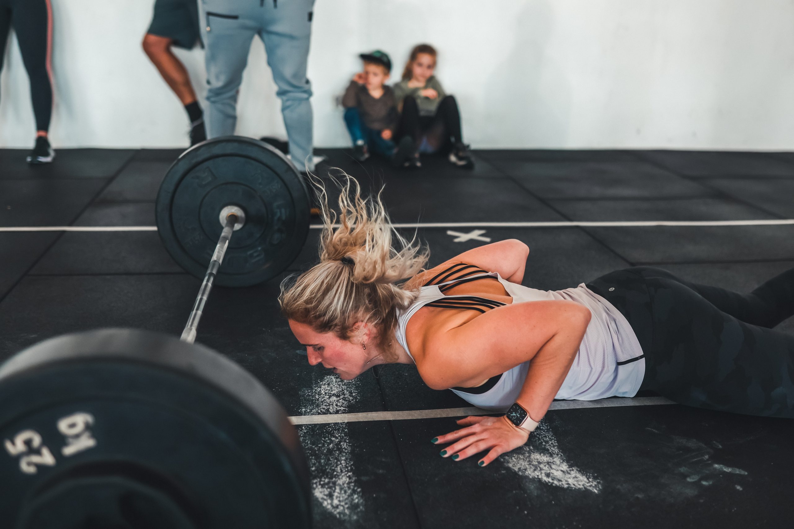 CrossFit Athlete performing Open 22.2, burpees over-the-bar