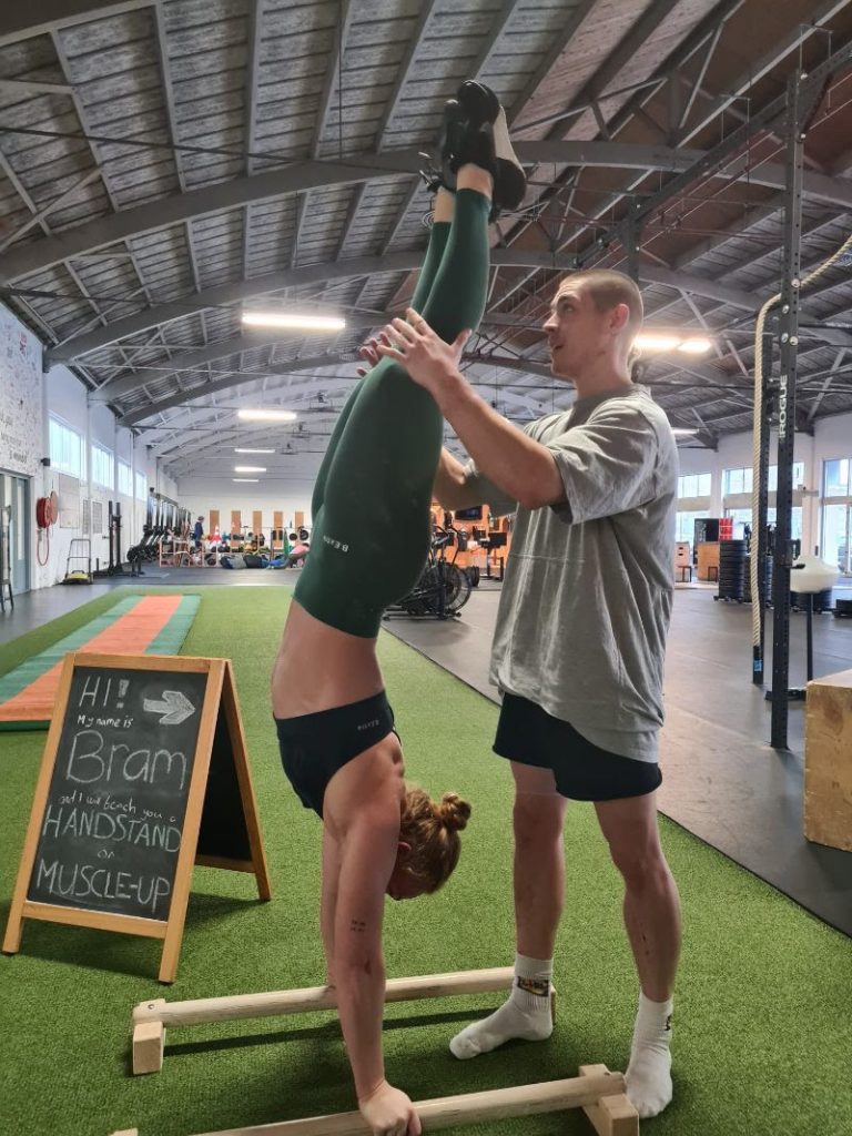 Bram giving a handstand personal training